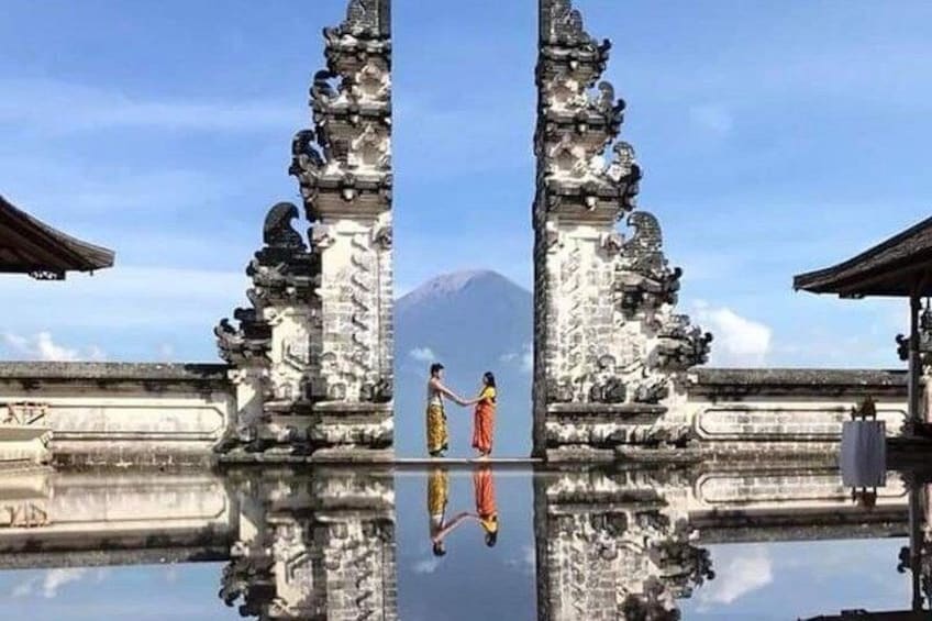 A temple with intricate carvings and a person in traditional attire. 3