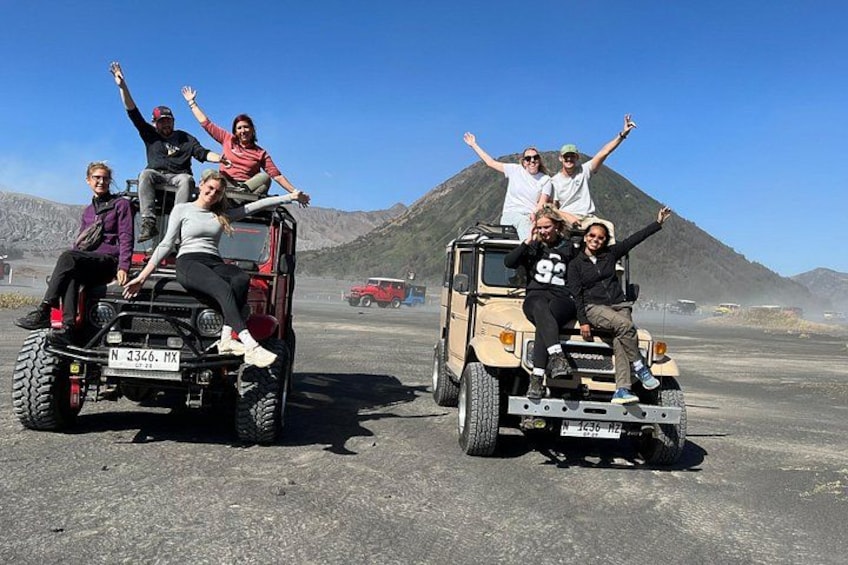 Four people on a vehicle with a license plate N 3366 MX, and another vehicle in the background. 4