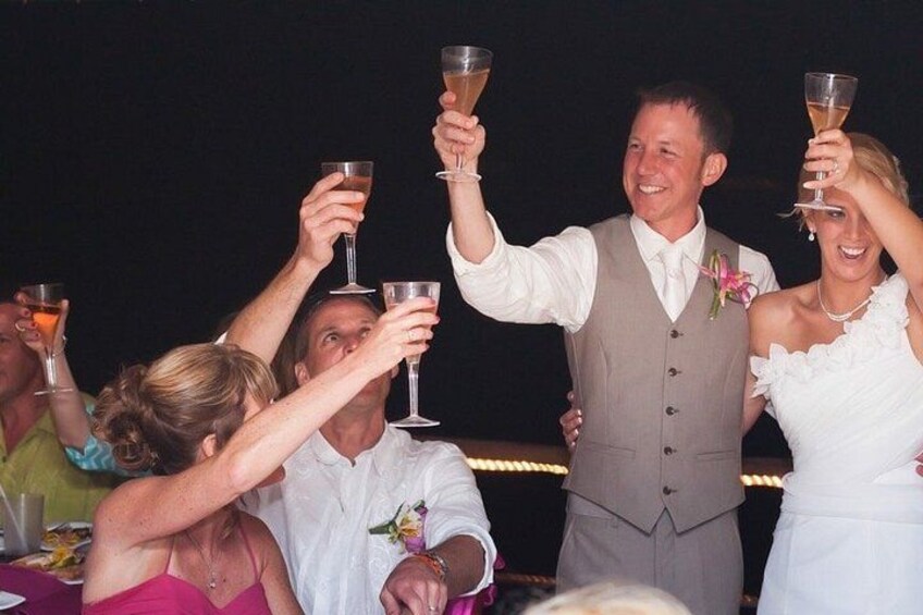 A group of people toasting with champagne glasses. 3