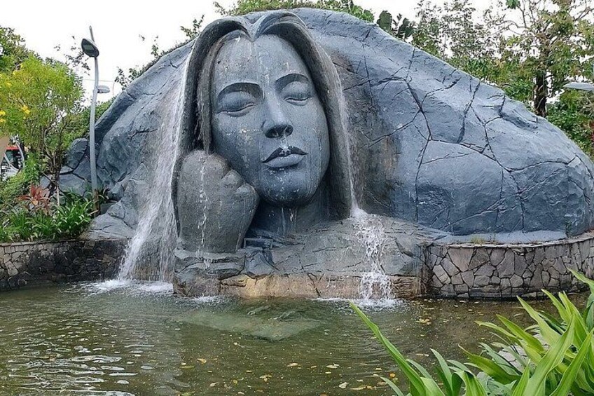 A rock sculpture with a waterfall feature. 4