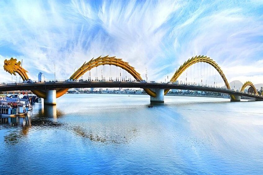 A bridge with dragon-shaped arches over a body of water. 2