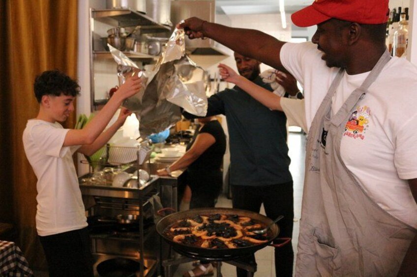 People preparing food in a kitchen. 2