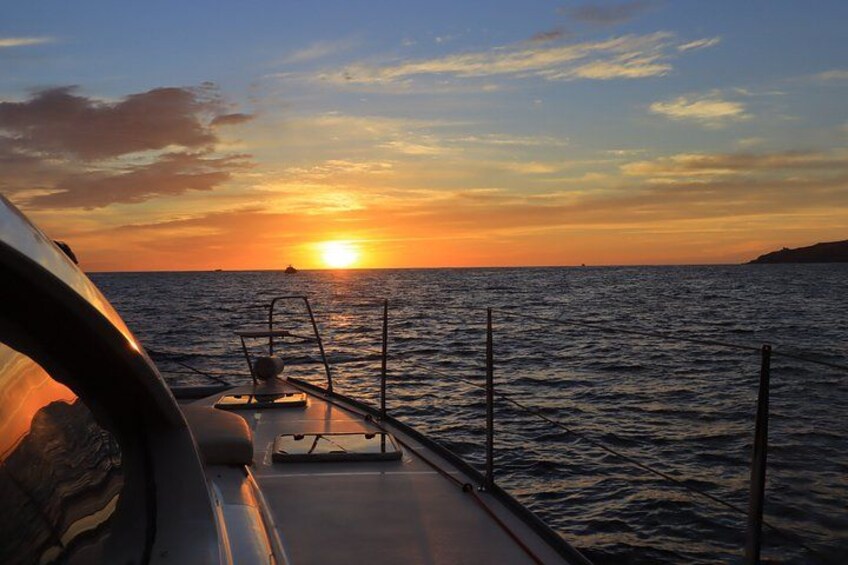 A sunset over the ocean from a boat. 4
