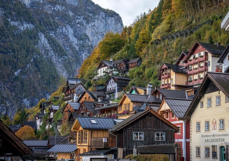 A mountainous village with wooden houses and a prominent church. 3