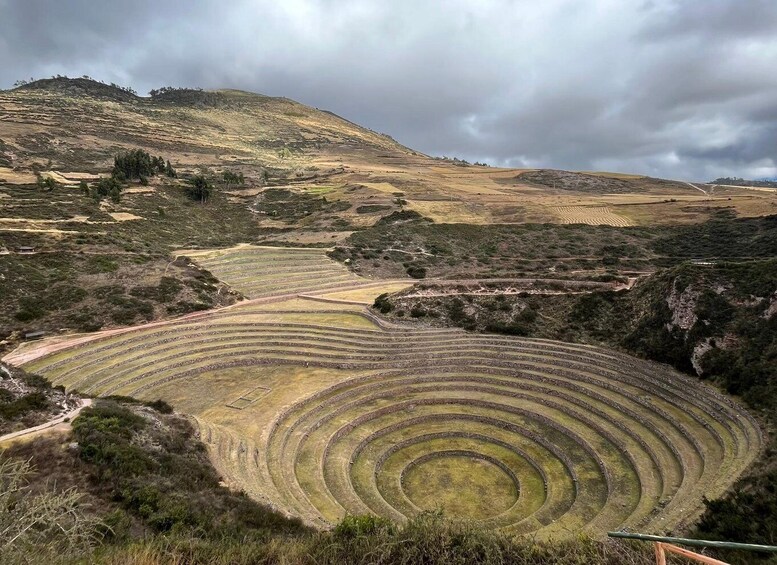 Terraced agricultural fields on a hillside under cloudy skies. 1