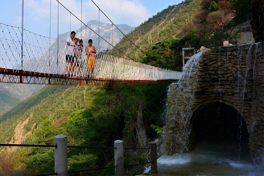 A suspension bridge, a stone tunnel, and a waterfall. 5