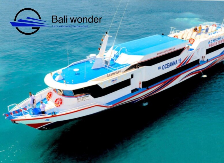 A large cruise ship named 'Oceanna 19' with passengers on deck, sailing on clear blue waters. 1