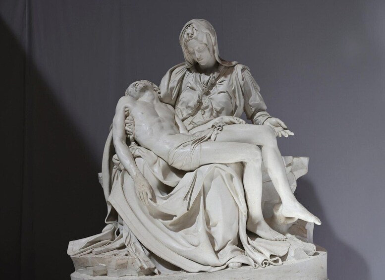 A marble sculpture of a reclining male figure and a seated female figure, likely representing a historical or religious scene. 5