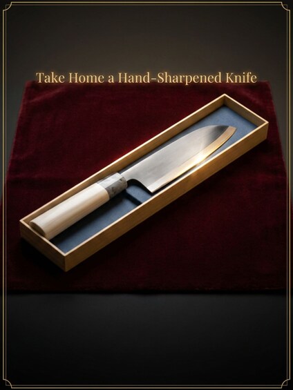 A hand-sharpened knife in a wooden box on a dark surface. 5