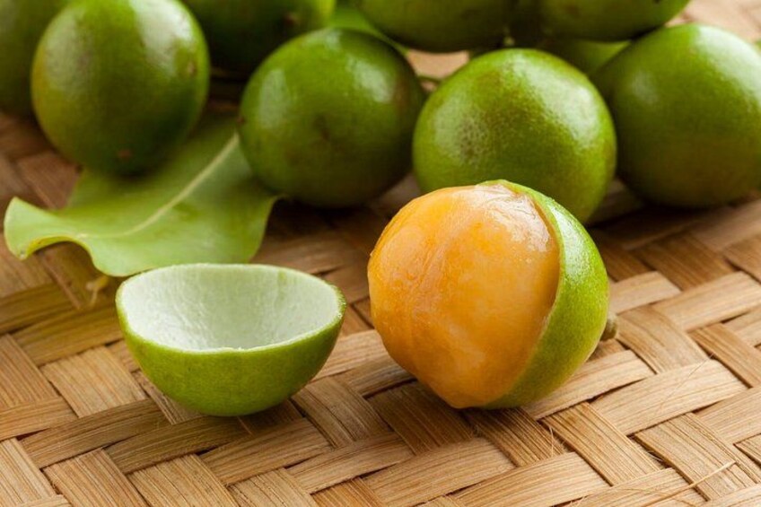 Green limes on a woven surface. 3