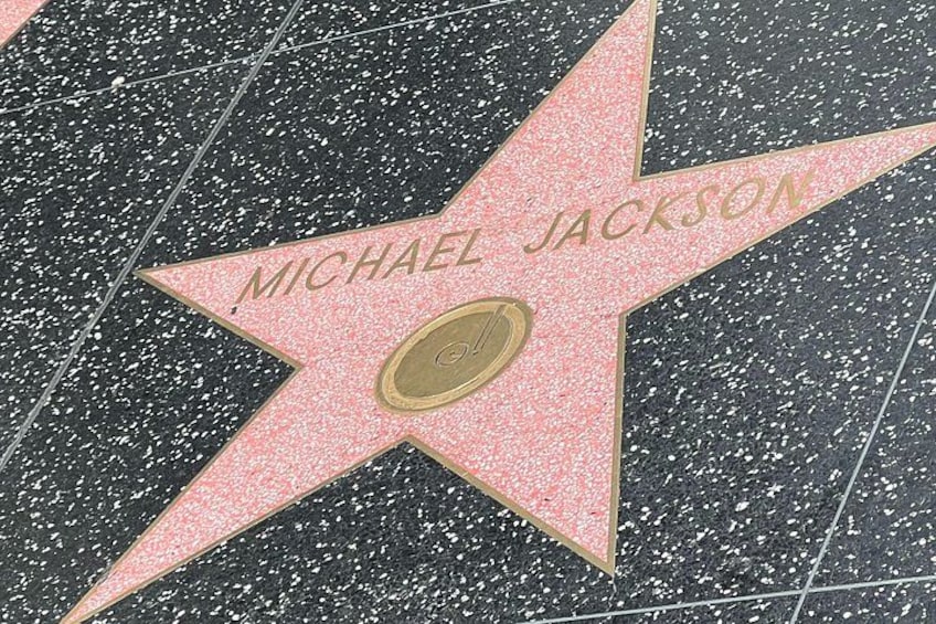 A star on the Hollywood Walk of Fame with the name 'MICHAEL JACKSON' engraved on it. 5