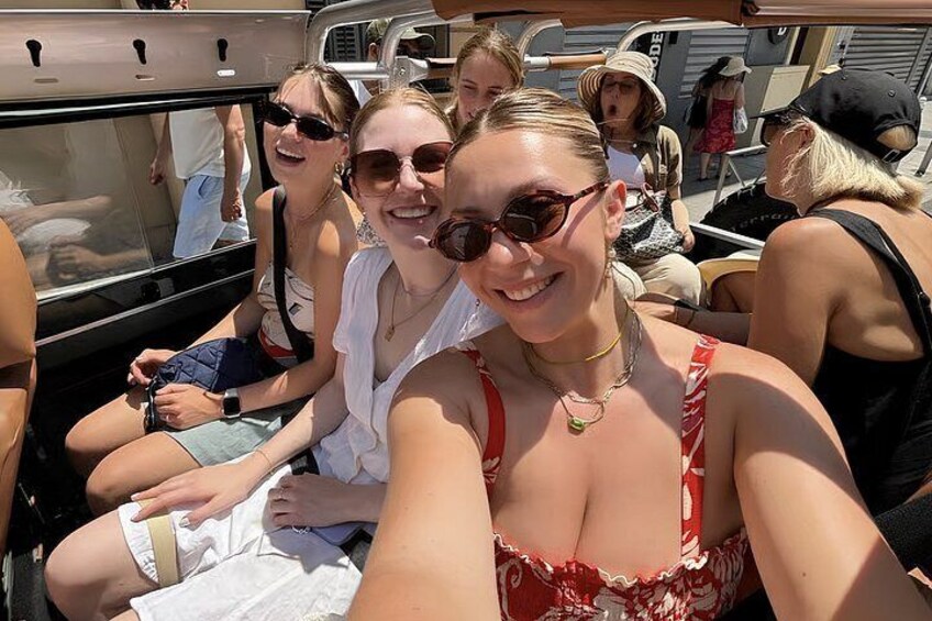 A group of people on a boat with a clear sky. 2