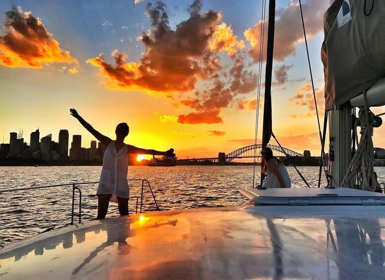 A sunset with a city skyline and a bridge in the background. 3