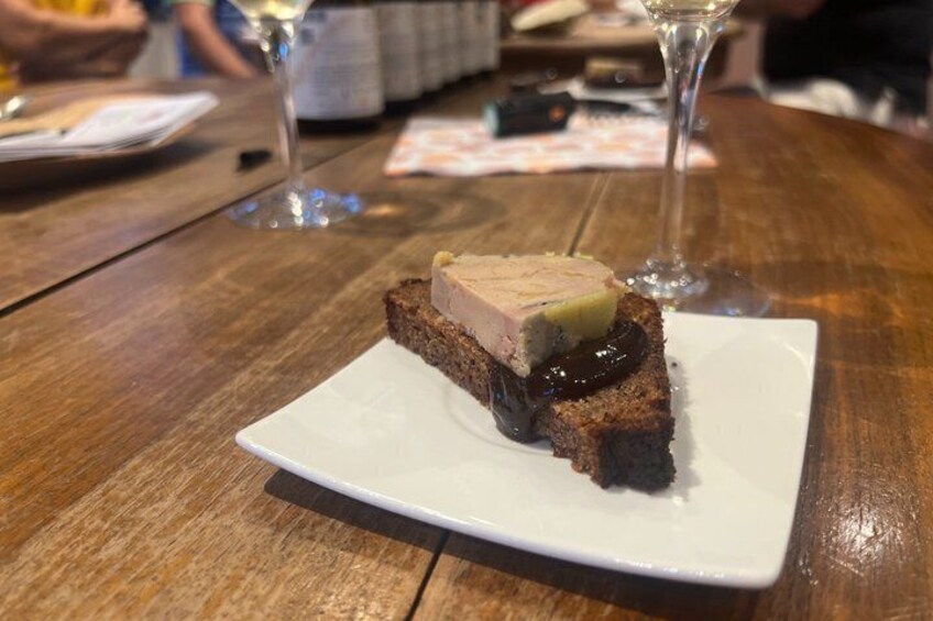 A slice of cake on a white plate on a wooden table. 3
