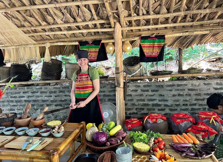 A market stall with various vegetables and fruits displayed on a wooden table. 2