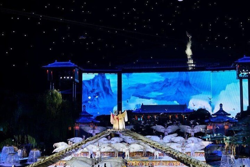 A traditional Chinese pavilion with a large screen displaying a mountainous landscape. 3