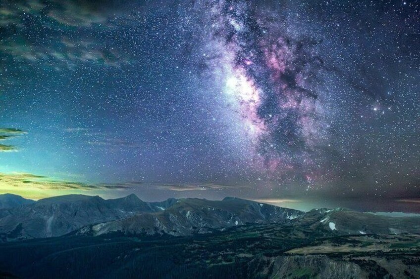 A starry night sky over a mountainous landscape. 5