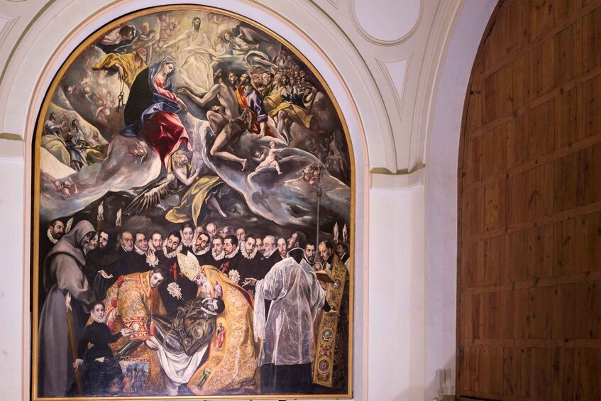 A mural with religious figures, a crowd, and a central figure in red. 4