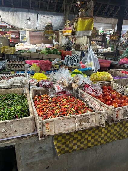 A market with various vegetables and fruits displayed in crates. 5