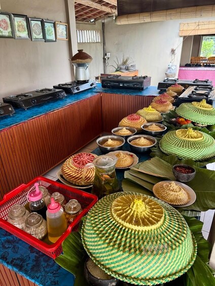 A food stall with various dishes and condiments. 4