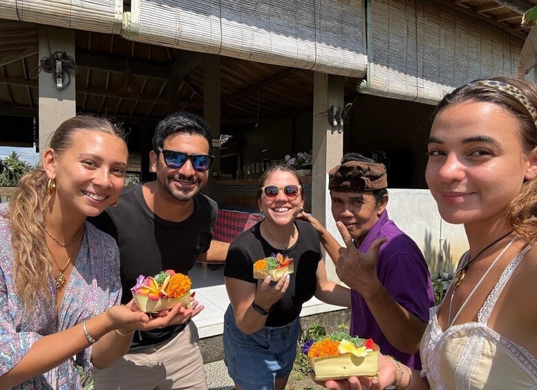 A group of people holding small baskets with flowers and food items. 3