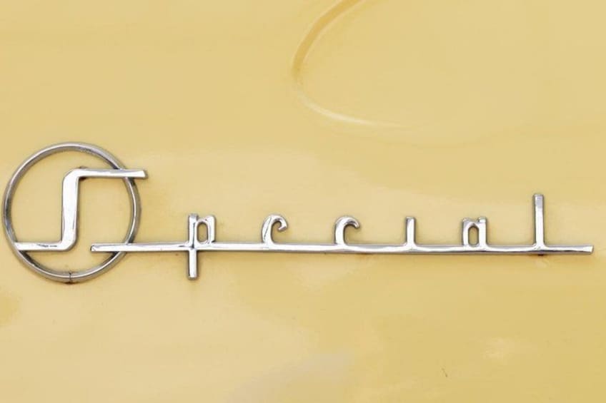 A metallic emblem with the word 'Special' on a yellow background. 5