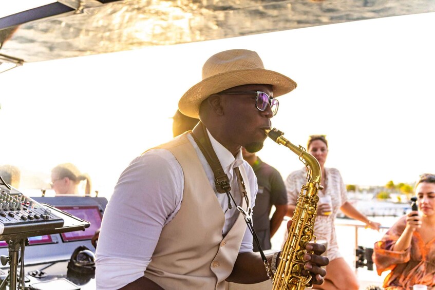 A person playing a saxophone. 5