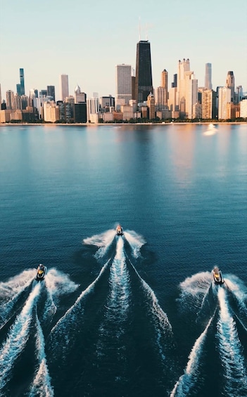 A city skyline with three speedboats creating wake patterns on the water. 5