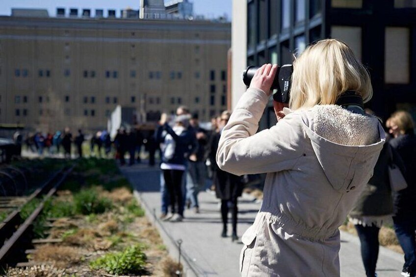 A person taking a photo with a camera. 1