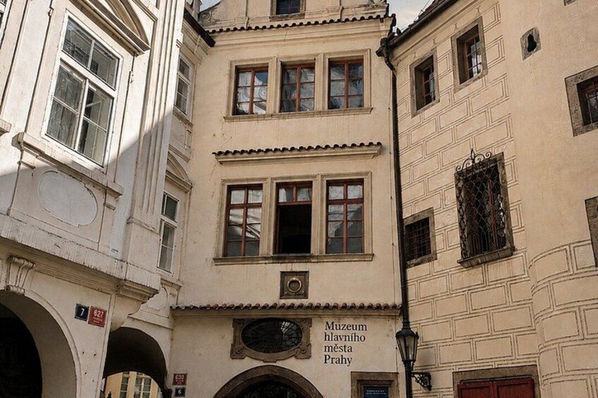 A building with a sign for the Museum of Illumination in Prague. 5