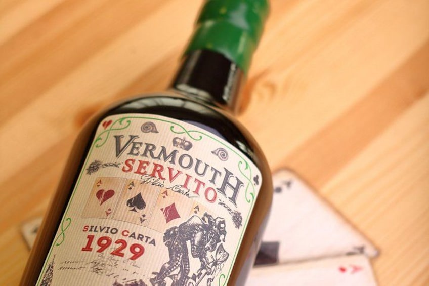 A bottle of Vermouth with a label featuring playing cards and the year 1929. 5