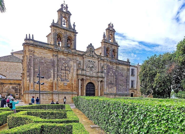 A historic church with two bell towers and intricate facade carvings. 3