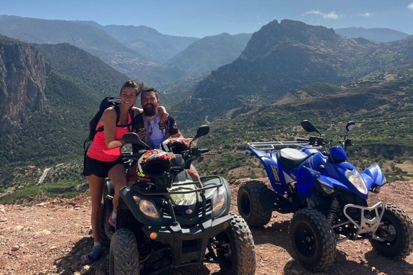 Two off-road vehicles on a mountain trail with a scenic view of mountains in the background. 5