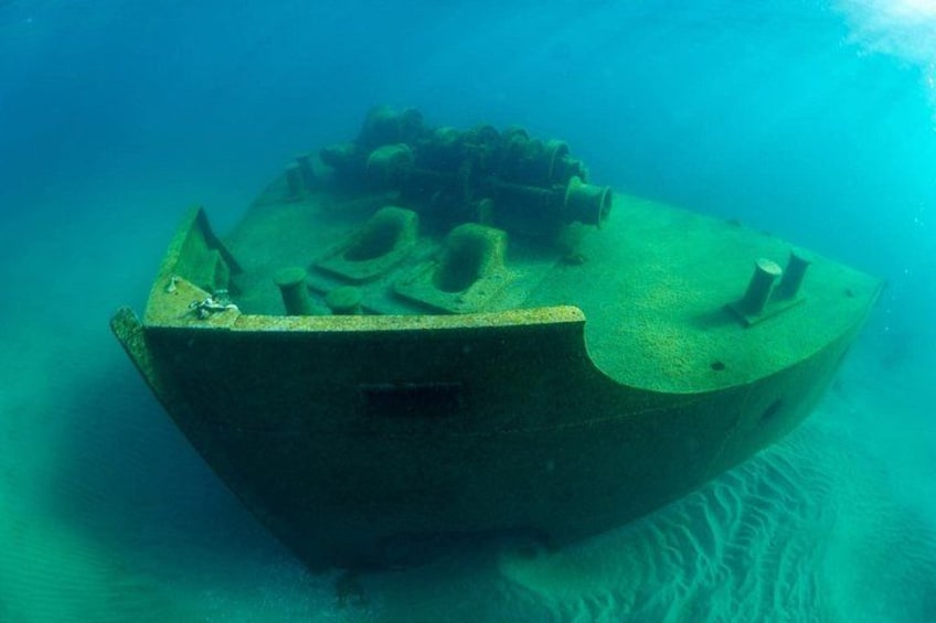An underwater shipwreck with visible damage and rust. 2