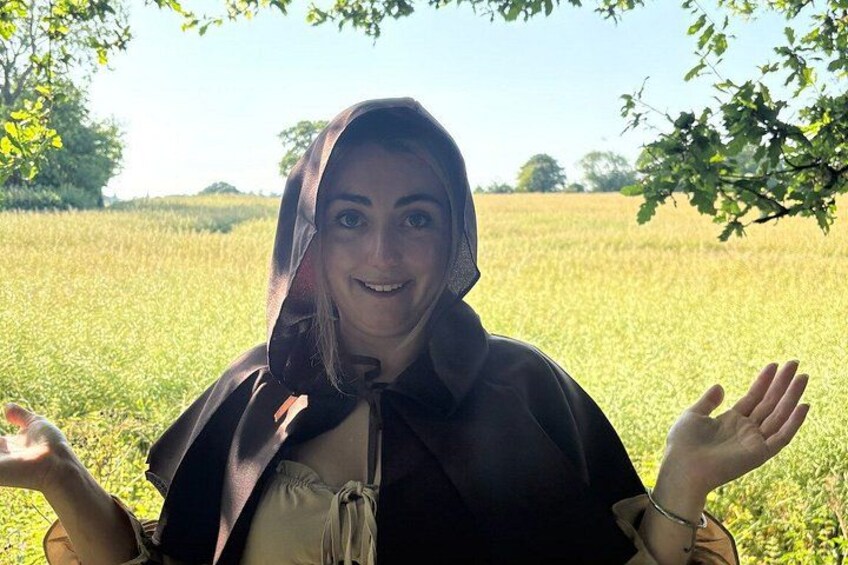 A person in a field with a tree in the background. 4