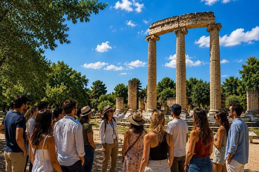 Tourists observing ancient columns in a historical site. 1