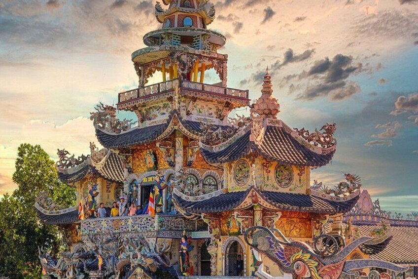 A traditional multi-tiered pagoda with intricate roof designs and vibrant decorations. 1