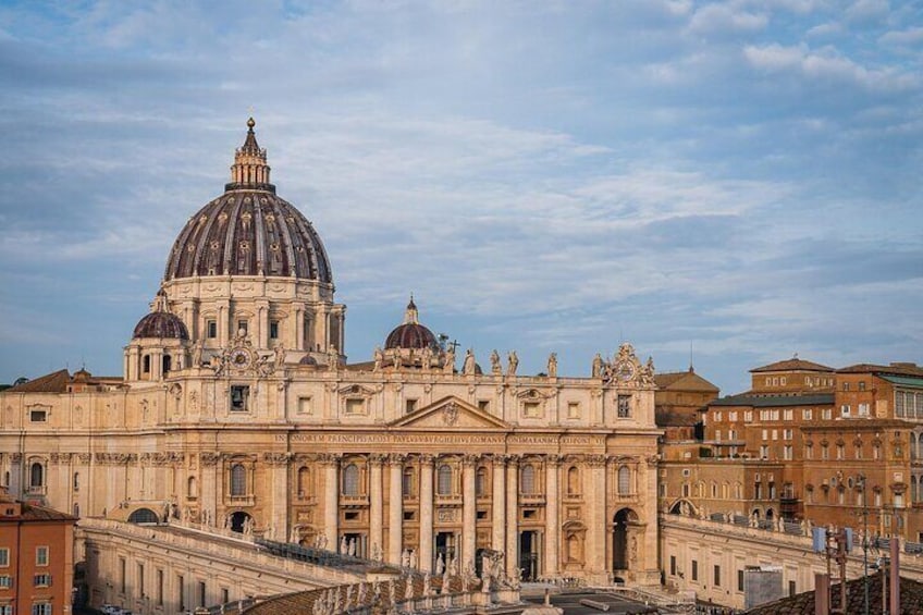 St. Peter's Basilica with its large dome and intricate facade. 1