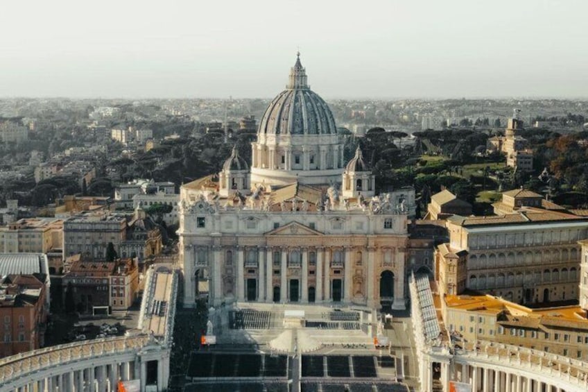 St. Peter's Basilica in Vatican City surrounded by cityscape. 4