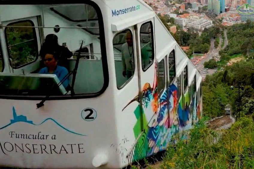 A cable car with a cityscape in the background. 3