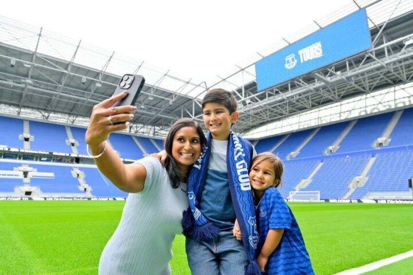 A stadium with blue seating and a 'TITANS' sign. 1