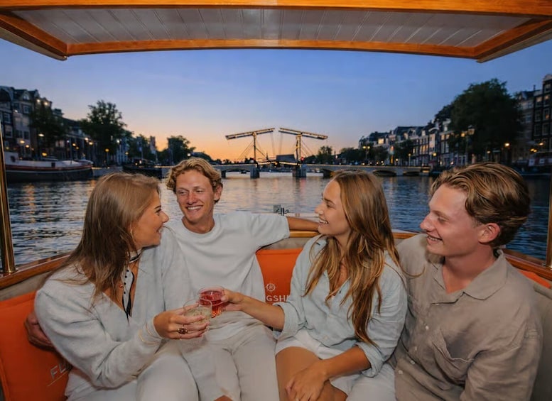 A group of people on a boat with a cityscape and a bridge in the background. 3