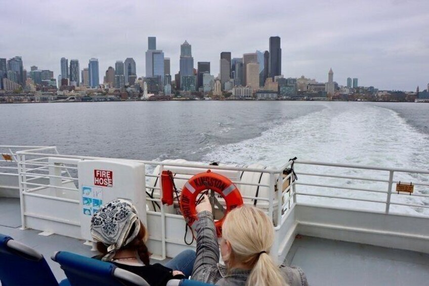 A boat with a city skyline in the background. 4