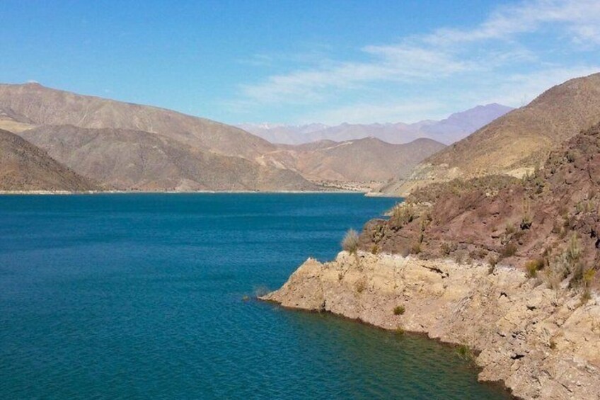 A large body of water surrounded by mountains. 3