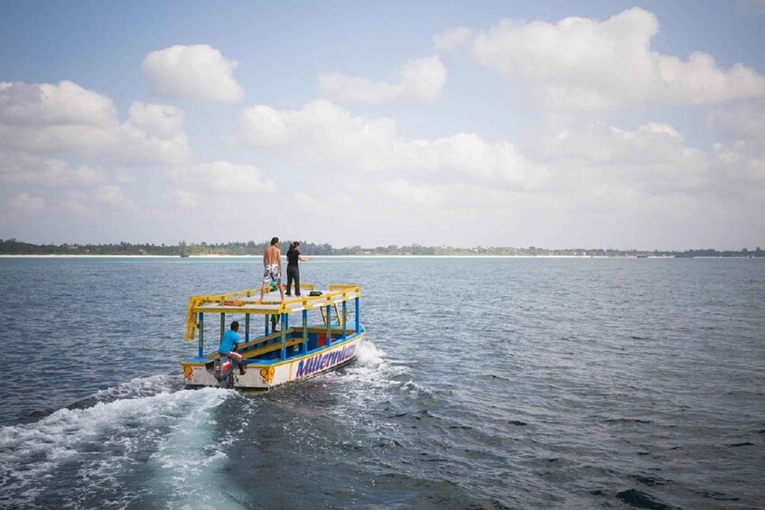 A boat with the name 'Milencum' on the water. 3