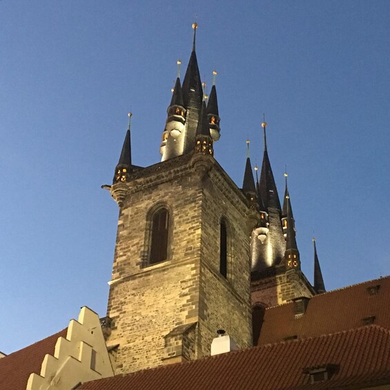 A historic church with multiple spires and a prominent clock tower. 1