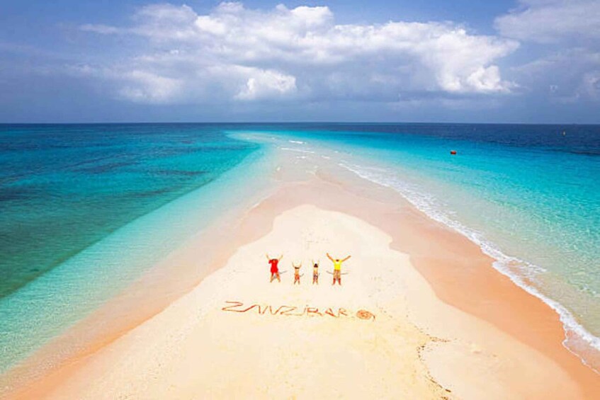 A beach with clear turquoise waters and a sandy shore. 3