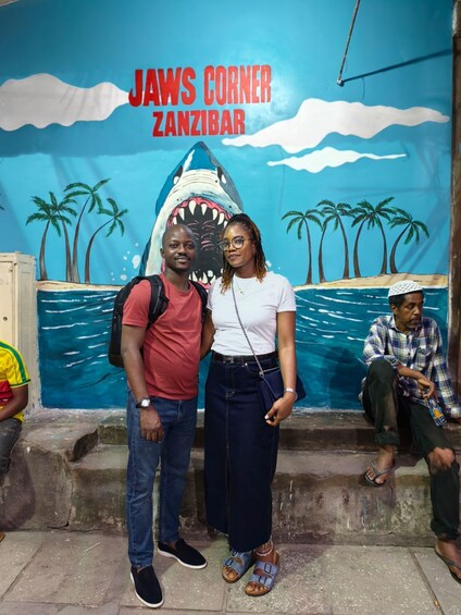 A mural with a shark and palm trees, titled 'JAWS CORNER ZANZIBAR'. 1