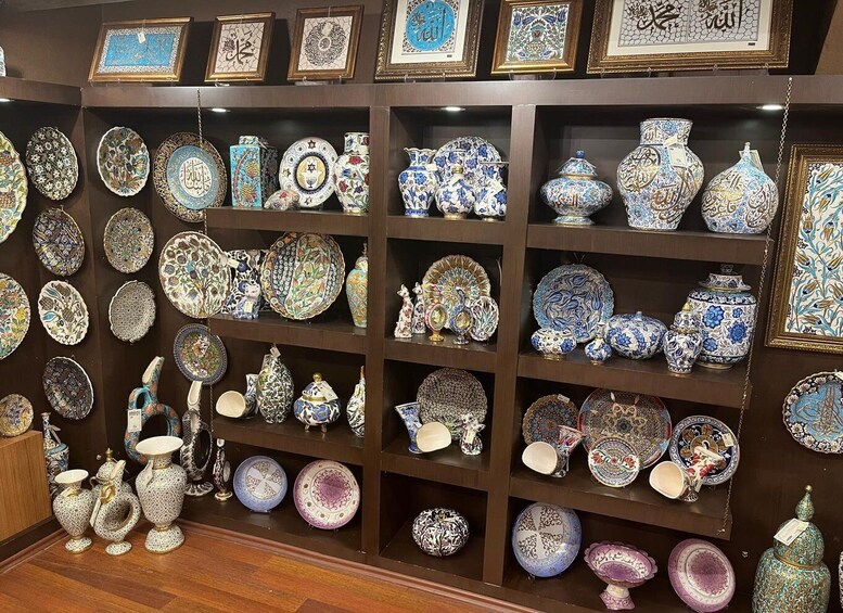 A display of intricately designed ceramic plates and vases. 3