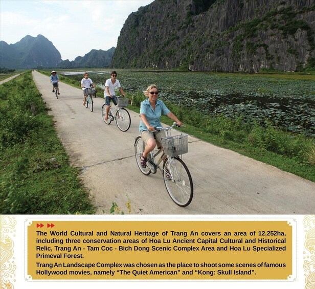 A paved path with cyclists, surrounded by lush greenery and a body of water. 5